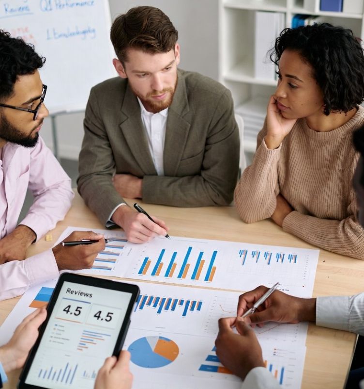 marketing team analyzing marketing charts